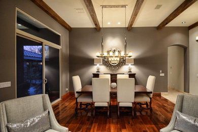 Transitional dark wood floor dining room photo in Phoenix with gray walls