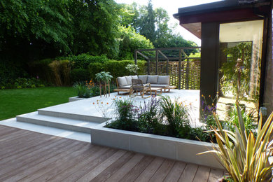 Design ideas for a modern patio in Surrey.