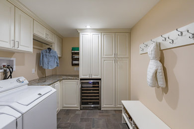 Small transitional laundry room photo in New York