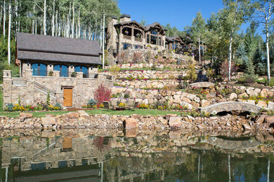 Inspiration for a huge rustic landscaping in Denver.