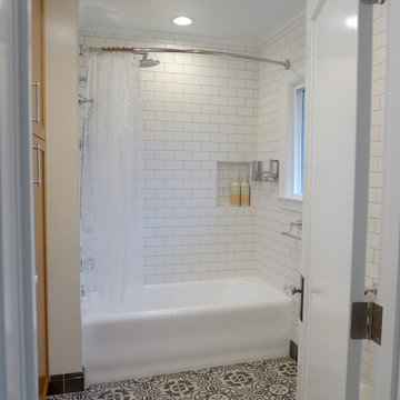 Beautiful patterned tile floor and subway tile walls