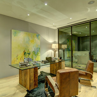 Modern home office and library in Los Angeles with grey walls.