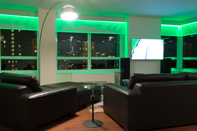 Large trendy formal and open concept dark wood floor living room photo in New York with white walls, no fireplace and a wall-mounted tv