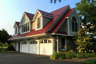 Garage workshop - large traditional attached three-car garage workshop idea in Philadelphia