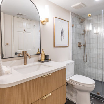 Warm & Inviting Basement Retreat with Custom Bar + Entertainment Center
