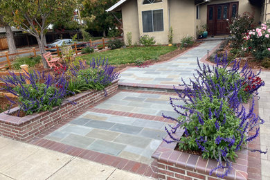 Design ideas for a farmhouse front yard stone and wood fence landscaping in San Francisco.
