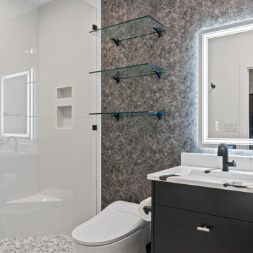 Modern Luxury Bathroom with Glass Shower, Backlit Mirror, and Marble Vanity