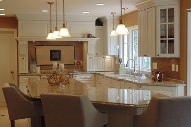 Inspiration for a mid-sized timeless l-shaped ceramic tile and beige floor eat-in kitchen remodel in Indianapolis with raised-panel cabinets, white cabinets, granite countertops, an island, an undermount sink, brown backsplash and glass tile backsplash