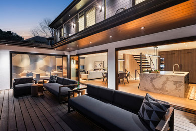 Deck - large contemporary backyard second story wood railing deck idea in Minneapolis