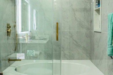 Inspiration for a 3/4 white tile and porcelain tile porcelain tile, white floor and single-sink sliding shower door remodel in Toronto with shaker cabinets, white cabinets, white walls, quartz countertops, white countertops, a niche and a built-in vanity