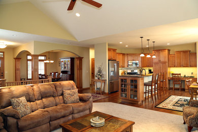 Inspiration for a mid-sized living room remodel in Other with beige walls, a standard fireplace and a stone fireplace
