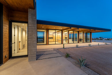 Inspiration for a large modern one-story wood house exterior remodel in Los Angeles