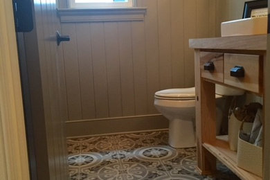 Example of a farmhouse powder room design in Louisville