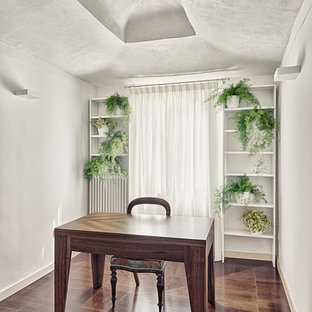 This is an example of a medium sized modern home studio in Venice with white walls, dark hardwood flooring and a freestanding desk.
