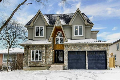 Example of a large transitional gray two-story stone exterior home design in Toronto with a shingle roof