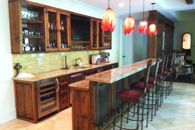 Seated home bar - large rustic galley ceramic tile and beige floor seated home bar idea in Atlanta with an undermount sink, glass-front cabinets, medium tone wood cabinets, granite countertops, beige backsplash and stone tile backsplash