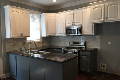 This kitchen we did the upper cabinets in crisp white,lower in gray