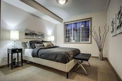 Trendy master carpeted bedroom photo in Calgary with white walls