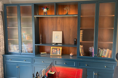 Medium sized traditional home studio in Other with white walls, medium hardwood flooring, a freestanding desk and brown floors.