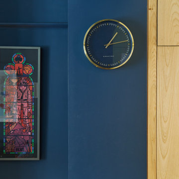 Blue colour drenched maximalist lounge
