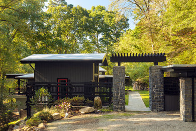 Large 1960s gray split-level mixed siding exterior home photo in Richmond with a gray roof
