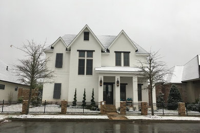 Example of a transitional home design design in New Orleans