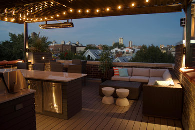 Outdoor kitchen deck - mid-sized transitional rooftop outdoor kitchen deck idea in Chicago with a pergola