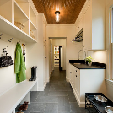 Mud room entryway with eating space for the dog