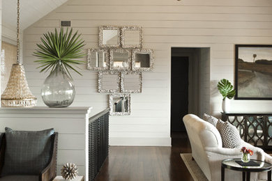 Inspiration for a large tropical open concept dark wood floor family room remodel in Charleston with white walls, no fireplace and no tv