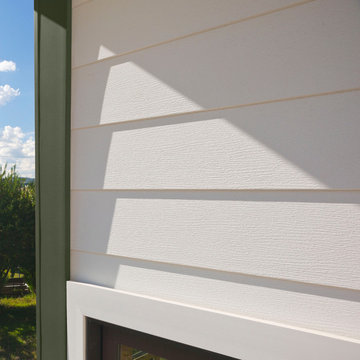 Celect® Cellular Composite 7" Siding by Royal® in Frost and Celect® Trim in Moss