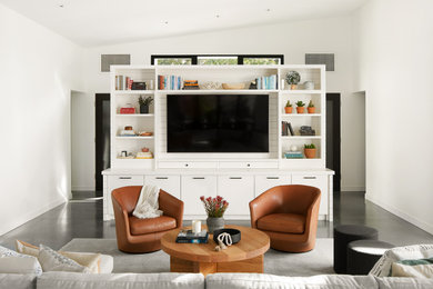 Living room - scandinavian open concept concrete floor, gray floor and vaulted ceiling living room idea in San Francisco with white walls and a media wall