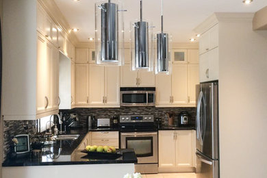 Kitchen - transitional kitchen idea in Toronto