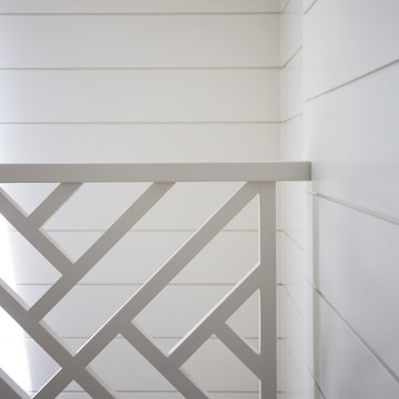 Banister Detail with White Shiplap Wall
