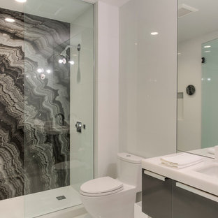 Example of a trendy white tile and porcelain tile marble floor doorless shower design in Miami with an undermount sink, quartzite countertops, a one-piece toilet and white walls