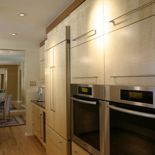Inspiration for a contemporary kitchen in Denver with louvered cabinets, light wood cabinets, soapstone worktops, stainless steel appliances, medium hardwood flooring and no island.