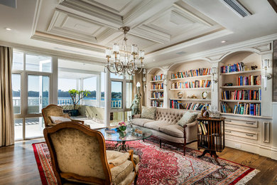 Photo of a mid-sized traditional open concept living room in Perth with beige walls, dark hardwood floors and a built-in media wall.