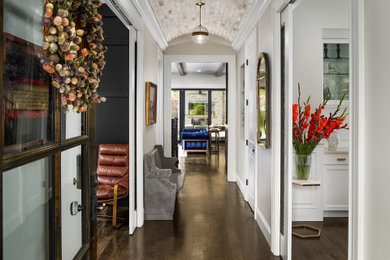 Entryway - transitional dark wood floor, brown floor and vaulted ceiling entryway idea in Denver with gray walls and a glass front door