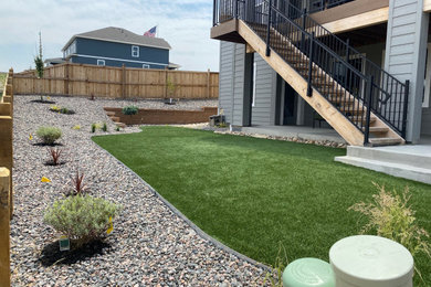 Design ideas for a mid-sized modern backyard landscaping in Denver.