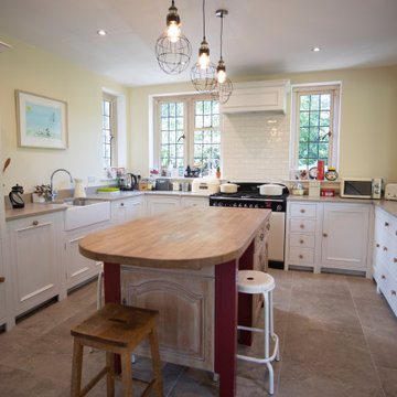 Traditional, bright kitchen with upcycled island