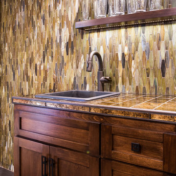 View of Wet Bar and Glass Mosaic Wall with LED Display Shelving