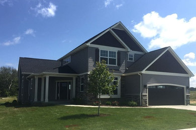 Inspiration for a large transitional gray two-story mixed siding exterior home remodel with a shingle roof