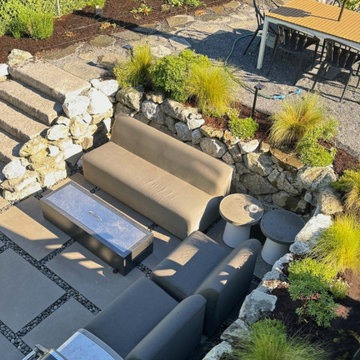 Gravel dining area patio and stairs to sunken patio