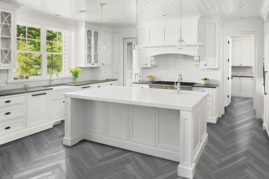 Eat-in kitchen - modern linoleum floor and gray floor eat-in kitchen idea in Charleston with white backsplash, an island and white countertops