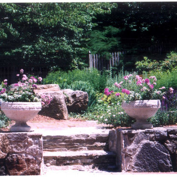 Colorful stone planters define the entrance