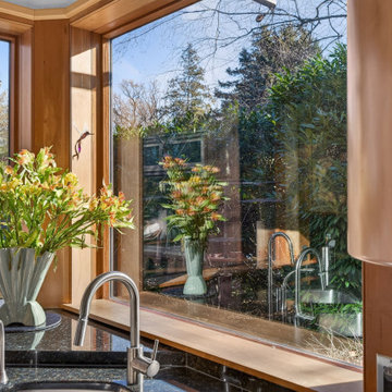 Luxury Mid-Century Kitchen with Custom Wood Cabinetry and Stone Countertops