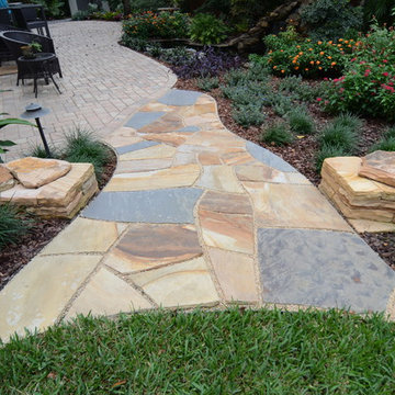 Natural Stone Dry-Stack Retaining Walls with Dry-Laid Stone Pathways