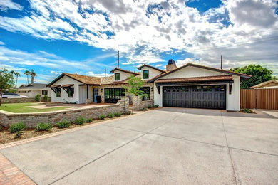 Photo of a country home design in Phoenix.