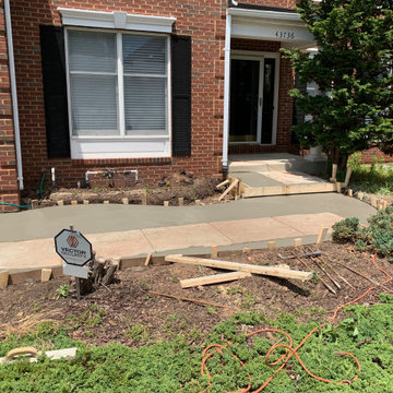 Limestone walkway with brick ascent to match house