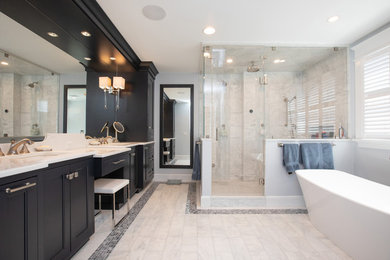 Example of a large trendy master white tile and marble tile marble floor and white floor bathroom design in Boston with beaded inset cabinets, dark wood cabinets, a one-piece toilet, blue walls, an undermount sink, quartz countertops, a hinged shower door and white countertops