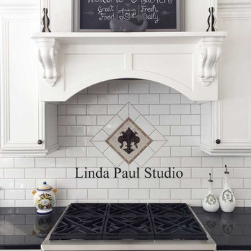 black and white kitchen with a nod to French Country Fleur de lis